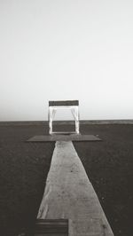 Lifeguard hut on beach against clear sky