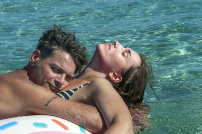 High angle view of couple in swimming pool