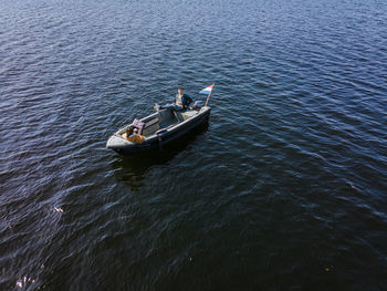 High angle view of people on boat sailing in lake