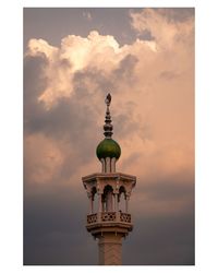 Low angle view of tower against sky during sunset