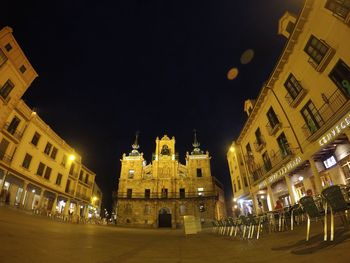 Low angle view of illuminated buildings at night