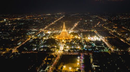 High angle view of illuminated buildings in city at night