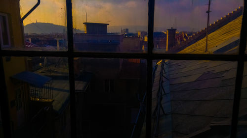 Buildings against sky during sunset