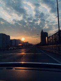 Road against sky seen through car windshield