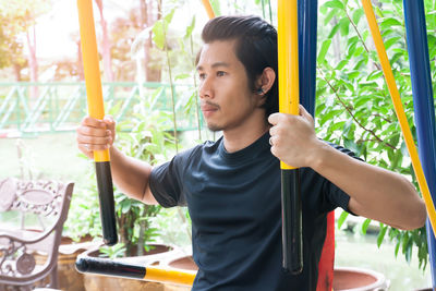 Young man exercising at park