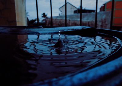 Reflection of building in puddle