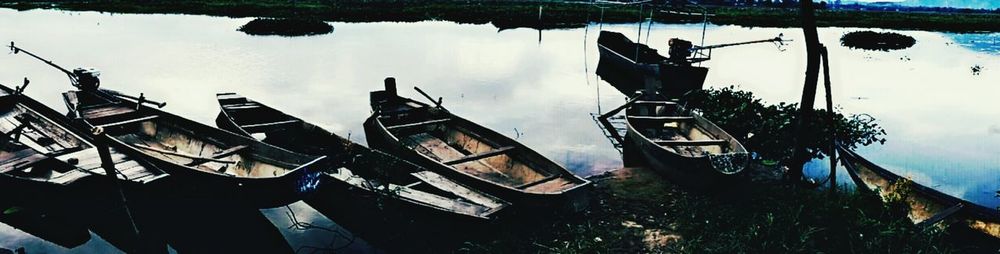 Panoramic shot of men hanging against sky