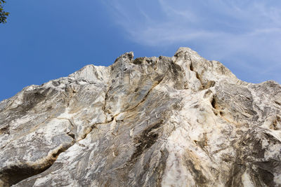 Low angle view of rock formations against sky