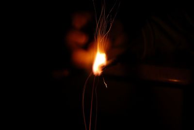 Close-up of burning candle