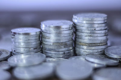 Close-up of stacked coins on table