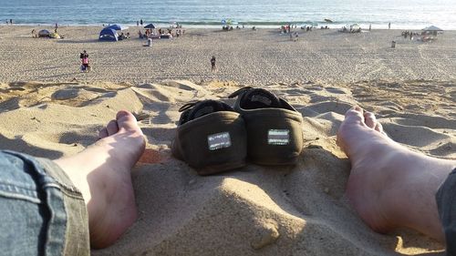 People relaxing on beach