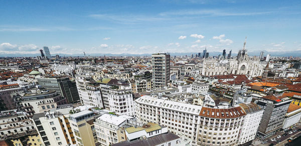 High angle view of city buildings against sky