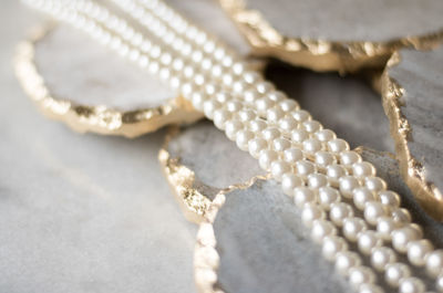 Close-up of wedding rings on table