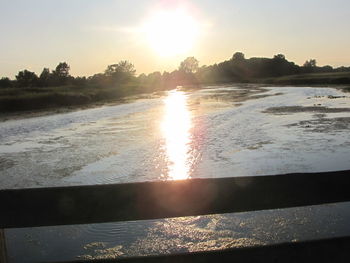 Scenic view of beach against sky during sunset
