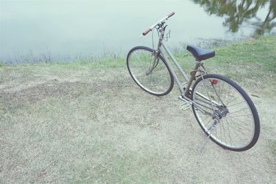 Bicycle parked on field