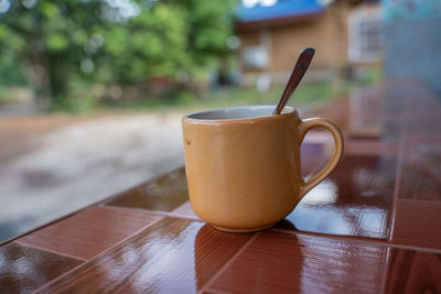 Close-up of coffee cup on table