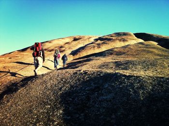 Hikers walking up hill