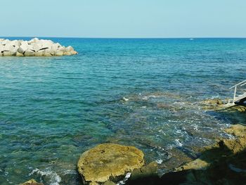 Scenic view of sea against blue sky