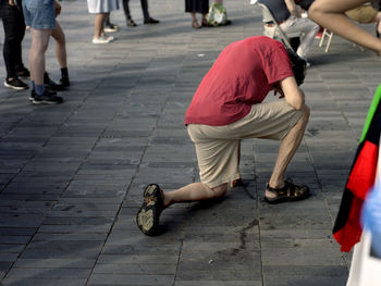 Low section of people walking on footpath