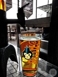 Close-up of beer glass on table at restaurant