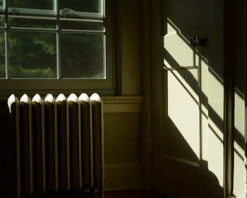 Sunlight falling on closed door at home