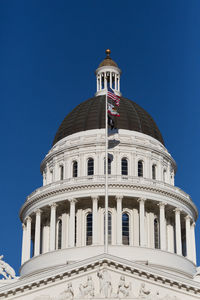 Low angle view of building against blue sky