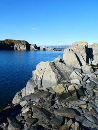 Scenic view of sea against clear blue sky