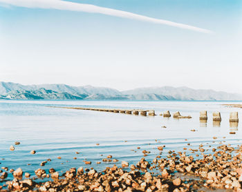 Scenic view of lake against blue sky