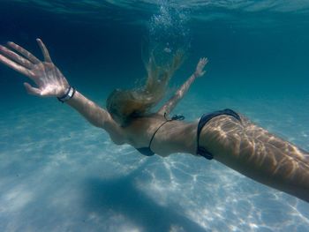 Woman swimming in sea