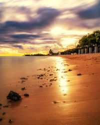 View of beach against cloudy sky