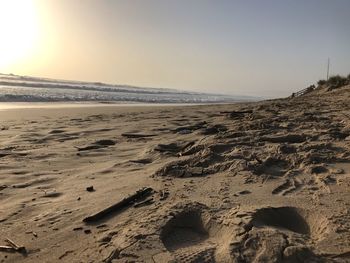 Scenic view of beach against clear sky