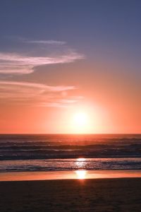 Scenic view of sea against sky at sunset