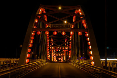 Illuminated suspension bridge at night