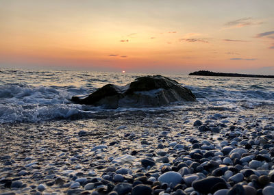 Scenic view of sea against sky during sunset