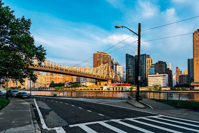 City street and buildings against sky