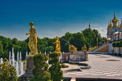 Statue of historic building against sky