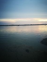 Scenic view of sea against sky at sunset