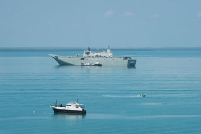 Ship sailing in sea against sky