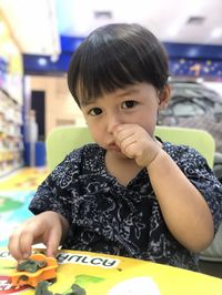 Portrait of cute boy sitting