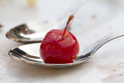 Close-up of cherry on spoon