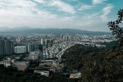 High angle view of buildings in city against sky