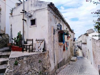 Narrow alley amidst buildings in town