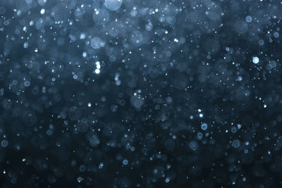 Full frame shot of wet glass during winter
