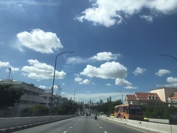 Cars on road against sky