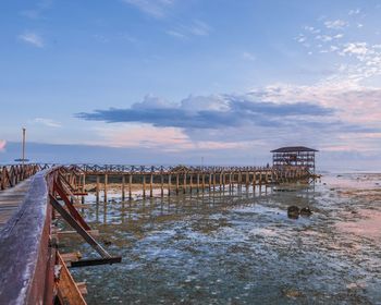 Pier over sea against sky