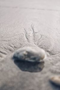 Full frame shot of pebbles on sand