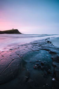 Scenic view of sea against sky during sunset