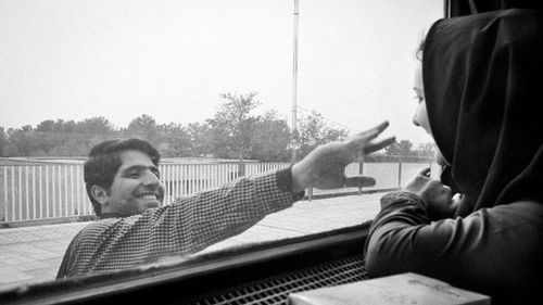Men playing guitar against sky