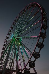 Low angle view of ferris wheel against sky