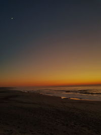 View of beach at sunset